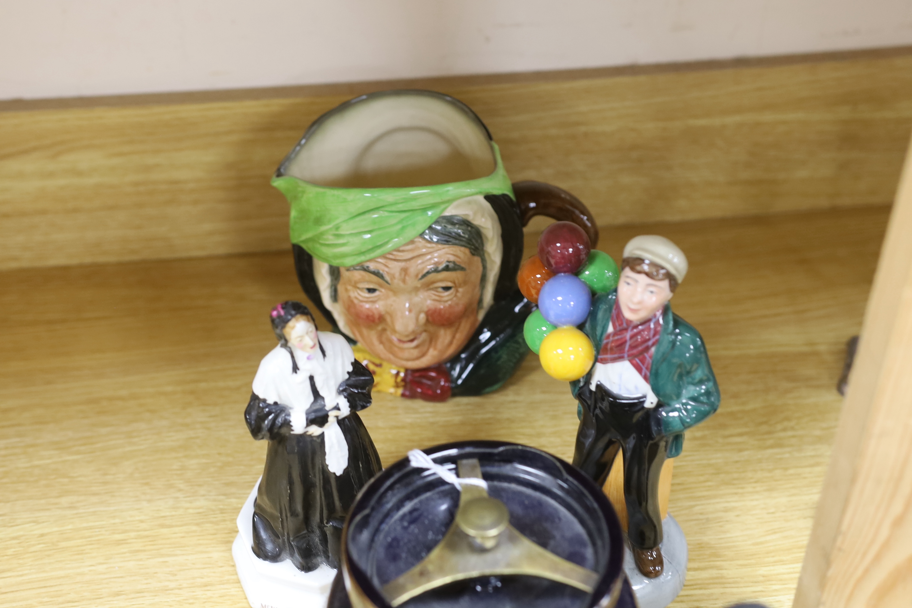 A Royal Doulton mug, two figures and a jar, a Clarice Cliff pepper and four other items (9), tallest Ballon Boy 20cm high